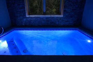 Night photo of your cabin's private pool.